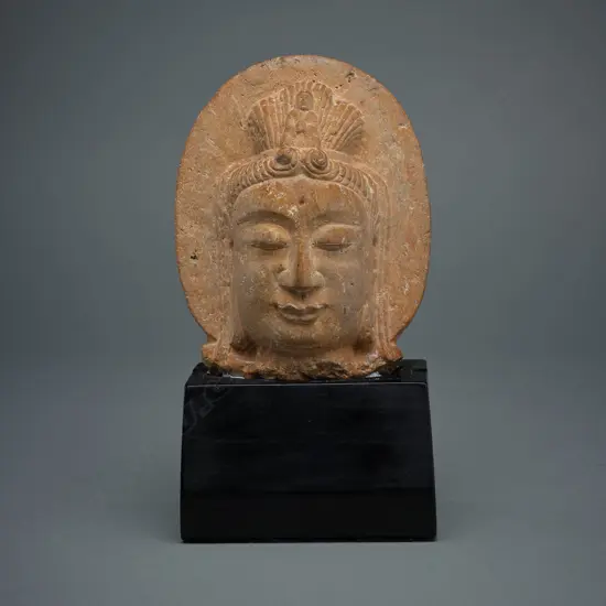 Gandhara style pink sandstone head of Bodhisattva,